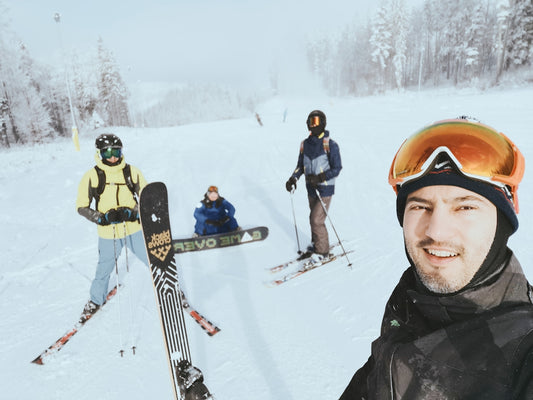 people in snow ski suit and snow ski blades