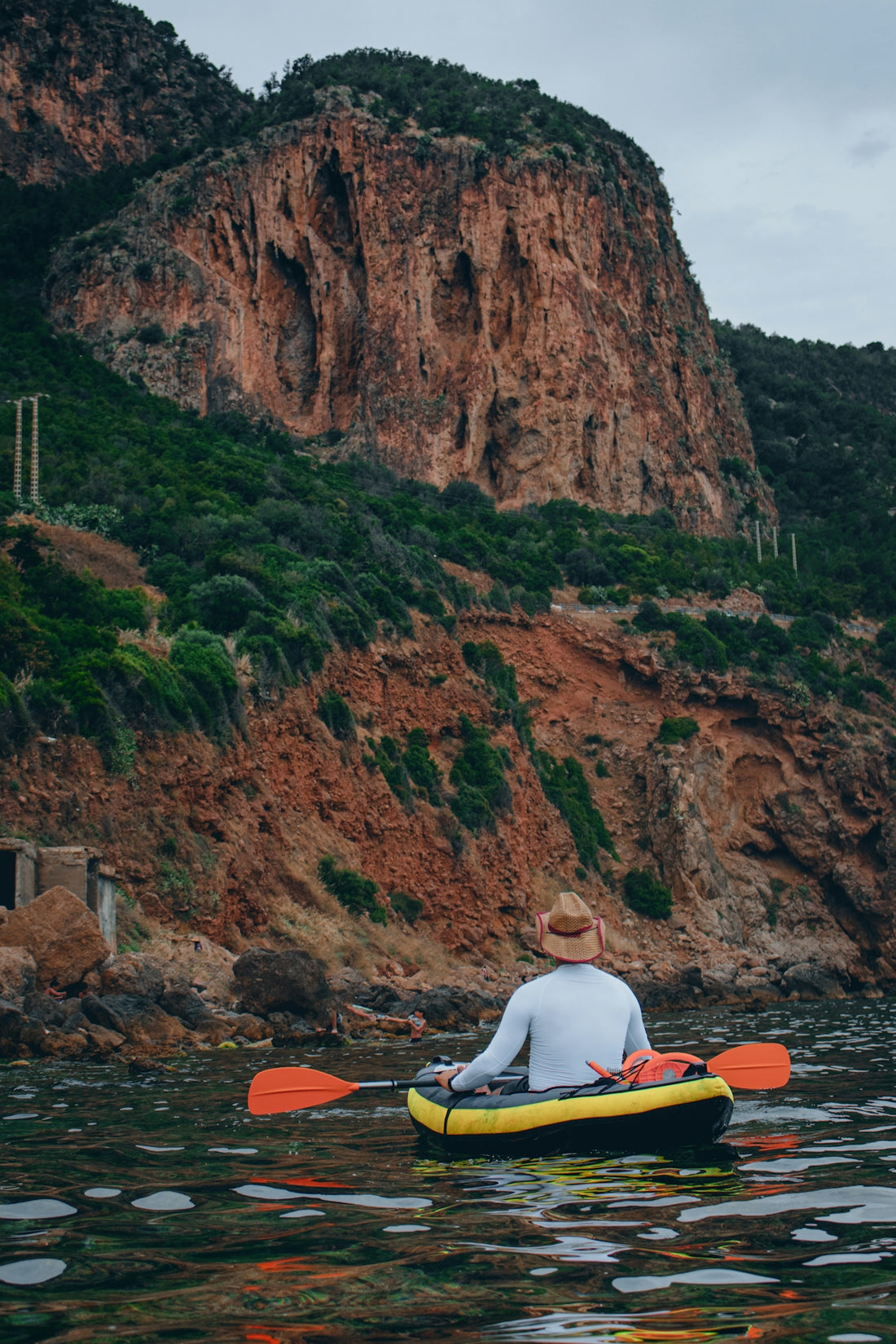 a man is paddling a kayak in the water