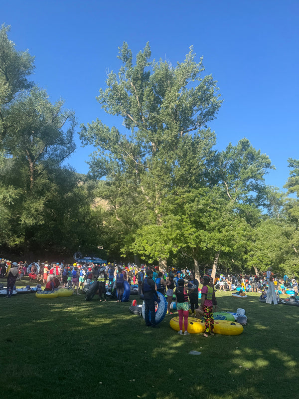 Large group with tubes and kayaks at Eben G Fine Park Boulder Creek