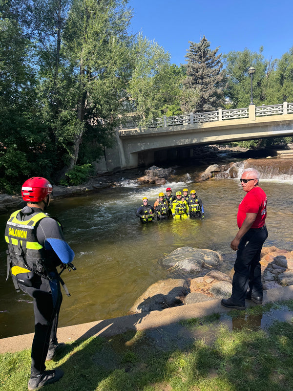 SkiBoulder guide leading group tubing on Boulder Creek